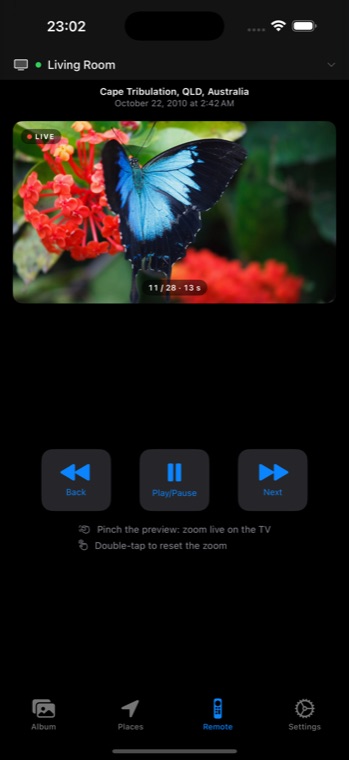 iPhone showing the LumaSlide remote with a live preview of the current photo